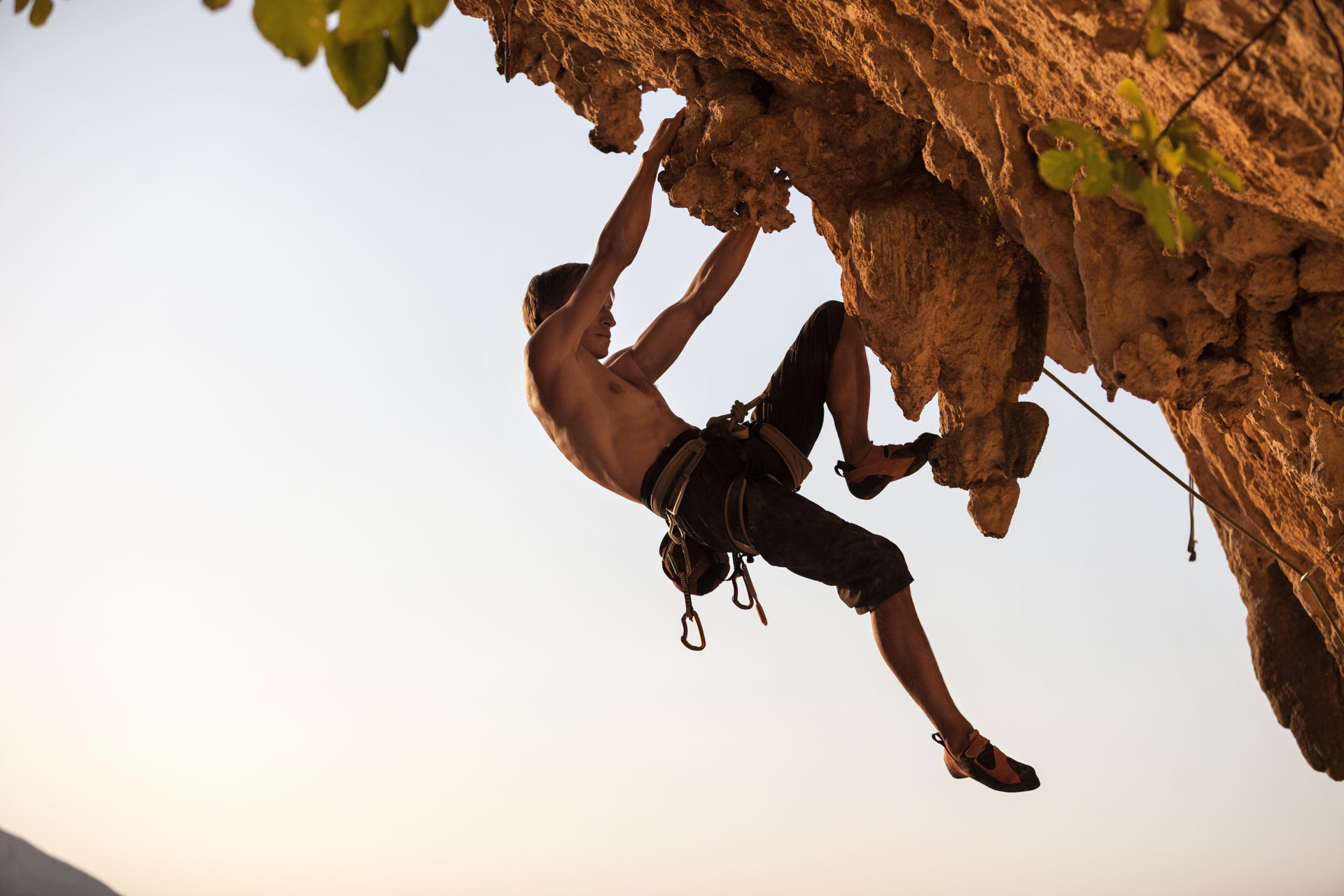 rock-climber-against-sky-at-sunset-e1695203351268.jpg