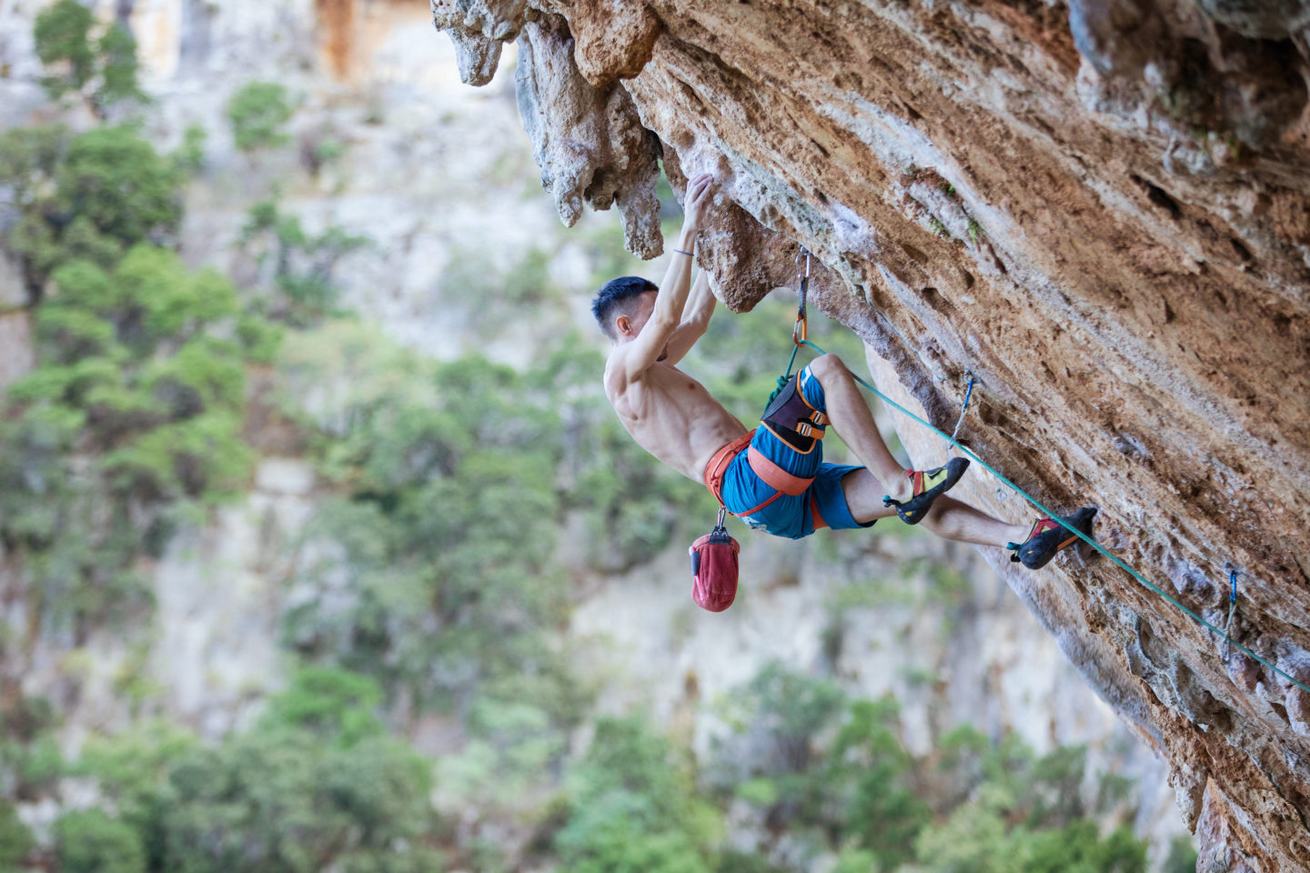rock-climber-on-challenging-route-on-overhanging-cliff-1-e1695354901892.jpg
